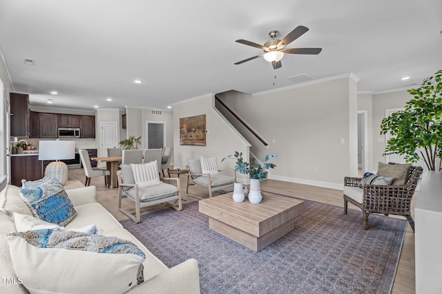 15 Diamond Creek Dr, Zebulon, NC 27597 - living area featuring ornamental molding, recessed lighting, a ceiling fan, stairs, and light wood-type flooring