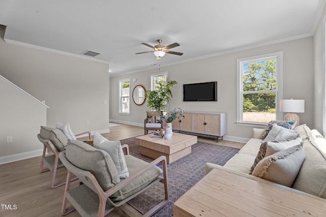 15 Diamond Creek Dr, Zebulon, NC 27597 - living room with light wood-type flooring, ceiling fan, and ornamental molding