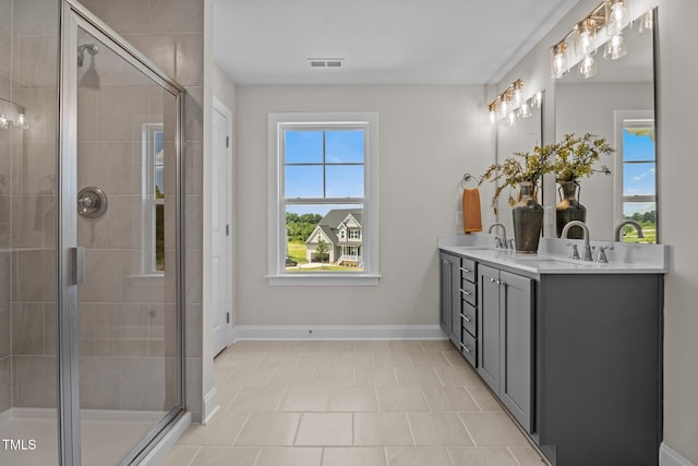 15 Diamond Creek Dr, Zebulon, NC 27597 - bathroom with double vanity and a stall shower