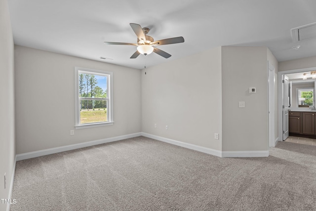 15 Diamond Creek Dr, Zebulon, NC 27597 - spare room with attic access, light carpet, and a ceiling fan