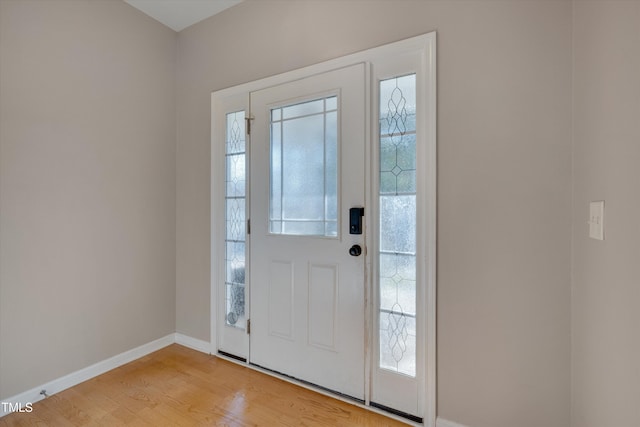 entryway with light hardwood / wood-style floors