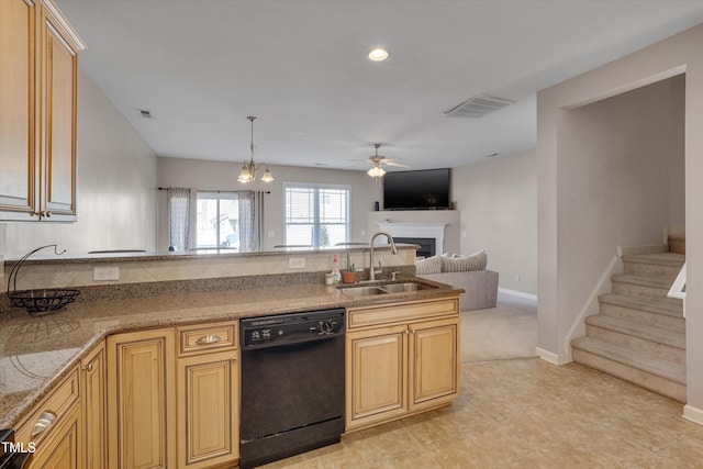 kitchen featuring ceiling fan with notable chandelier, black dishwasher, hanging light fixtures, sink, and light tile patterned floors