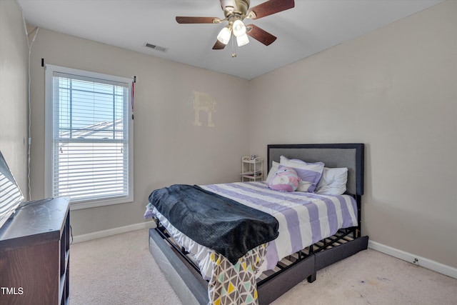 bedroom with light colored carpet and ceiling fan