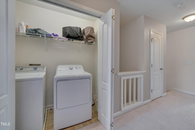 washroom with separate washer and dryer and light colored carpet