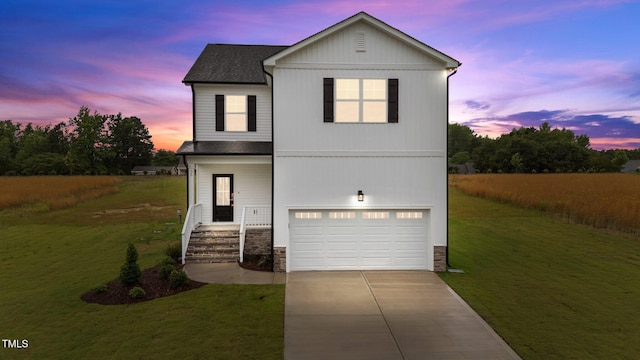 35 Diamond Creek Dr, Zebulon, NC 27597 - view of front of home with an attached garage, concrete driveway, a front yard, and stone siding