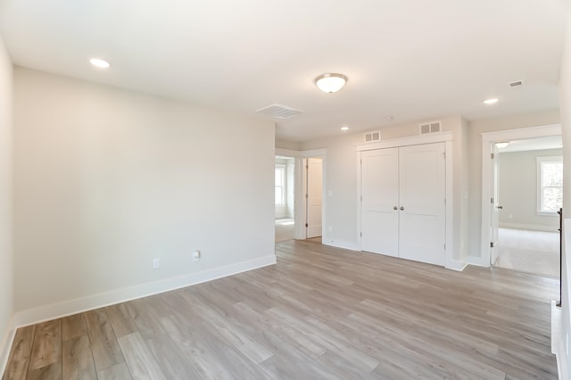 unfurnished room featuring light hardwood / wood-style flooring