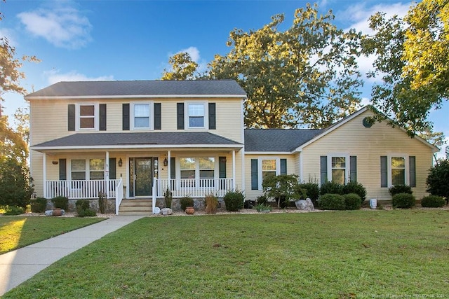 view of front facade with a porch and a front lawn