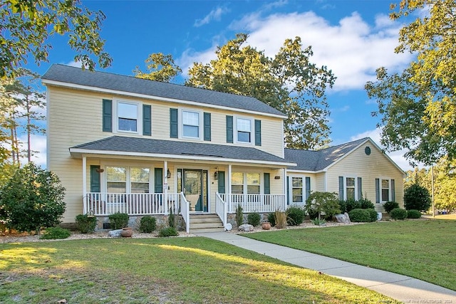 view of front of house featuring a front yard and a porch