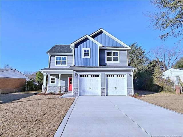 view of front of house with a garage and a porch