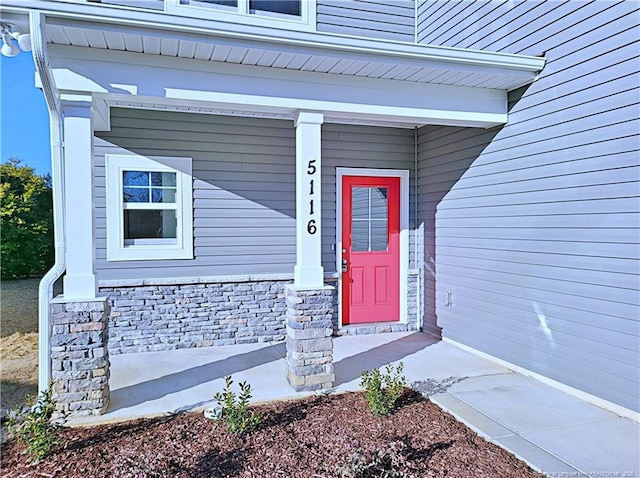 doorway to property featuring a porch