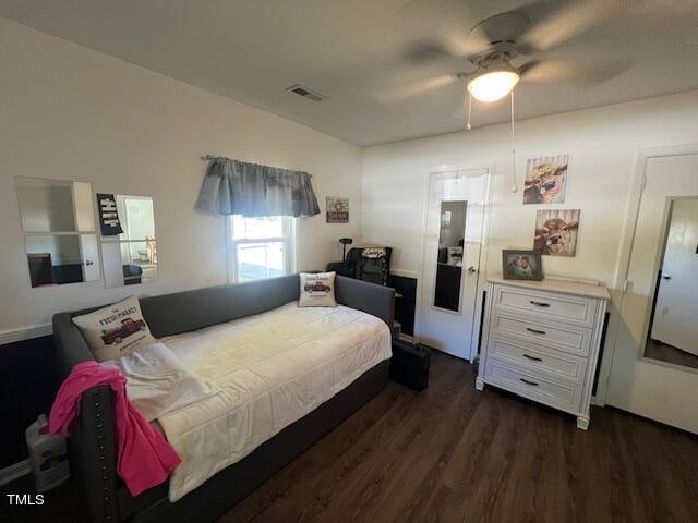 bedroom with dark wood-type flooring and ceiling fan