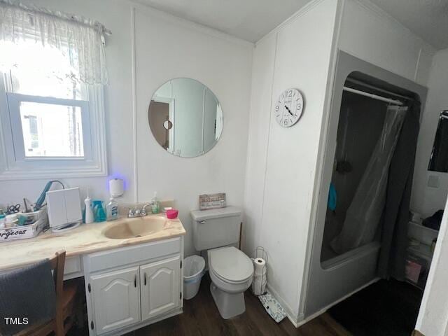 bathroom with toilet, vanity, wood-type flooring, and walk in shower