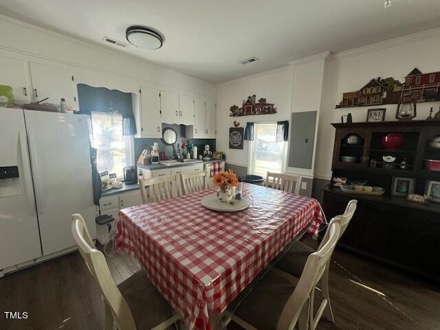 dining area featuring dark hardwood / wood-style flooring