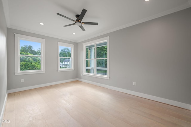 unfurnished room with crown molding, ceiling fan, and light hardwood / wood-style floors