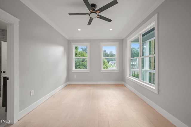 spare room with crown molding, light hardwood / wood-style flooring, and ceiling fan