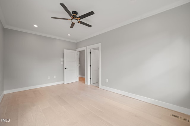 unfurnished bedroom with ceiling fan, crown molding, and light hardwood / wood-style flooring