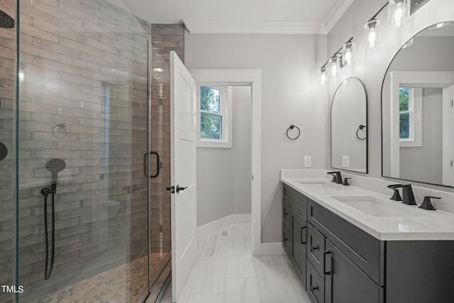 bathroom featuring plenty of natural light, a shower with shower door, crown molding, and vanity