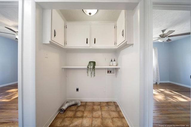 clothes washing area featuring hookup for a washing machine, wood-type flooring, hookup for an electric dryer, ceiling fan, and cabinets