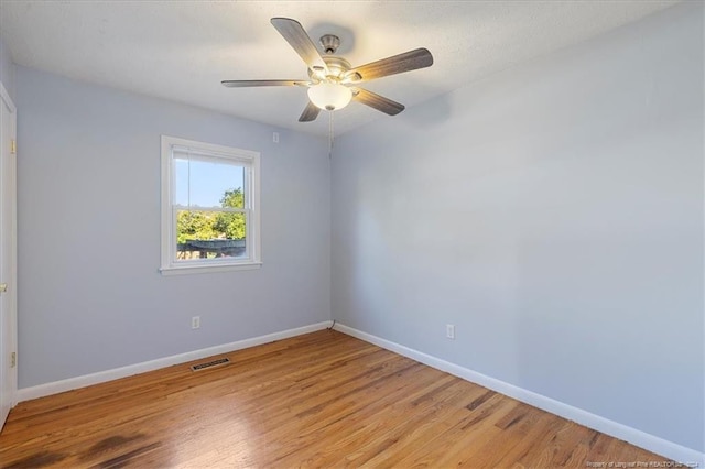 empty room featuring light hardwood / wood-style floors and ceiling fan