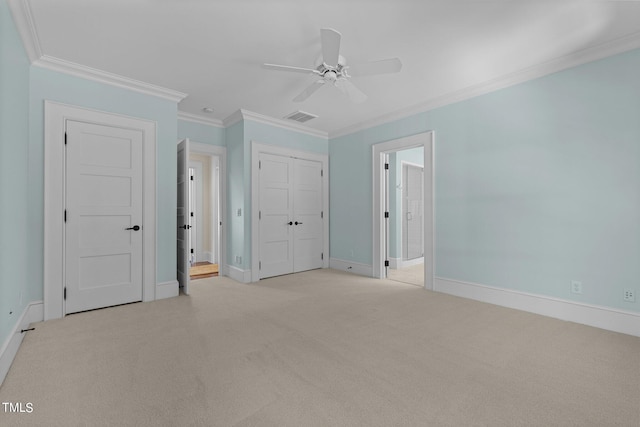 unfurnished bedroom with connected bathroom, ceiling fan, light carpet, and ornamental molding