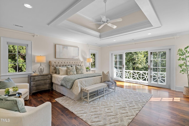 bedroom with access to exterior, dark wood-type flooring, a tray ceiling, crown molding, and ceiling fan