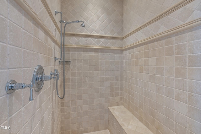 bathroom featuring tiled shower