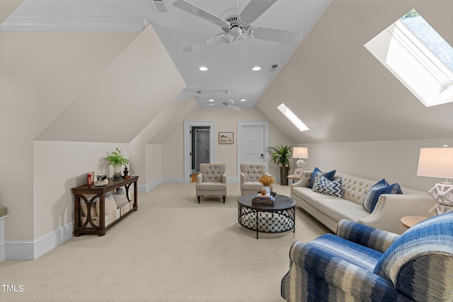 living room with light carpet, crown molding, lofted ceiling with skylight, and ceiling fan