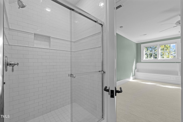 bathroom featuring a shower with door, ornamental molding, and ceiling fan