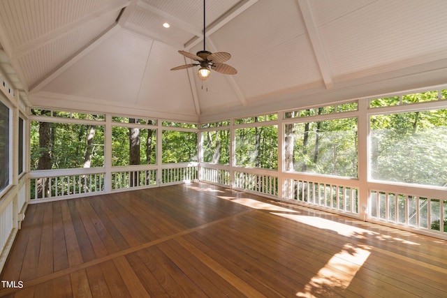 unfurnished sunroom with ceiling fan and vaulted ceiling