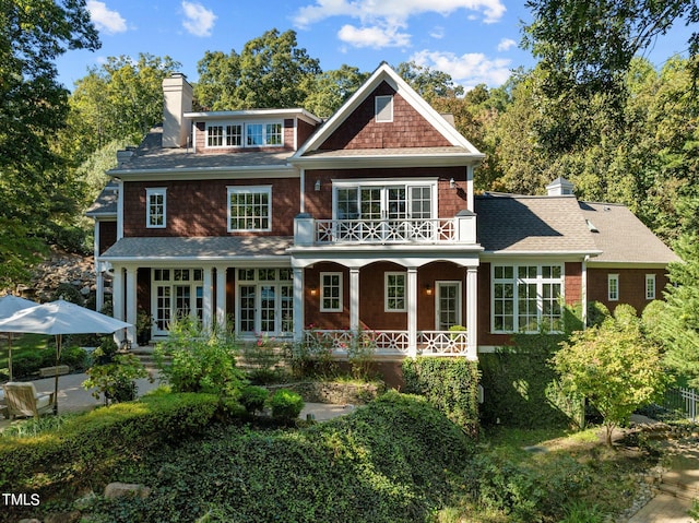 back of house with a balcony