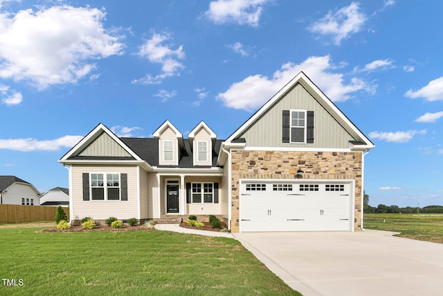 craftsman house featuring a front lawn and a garage