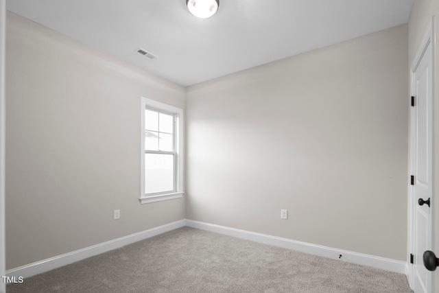 empty room with carpet flooring