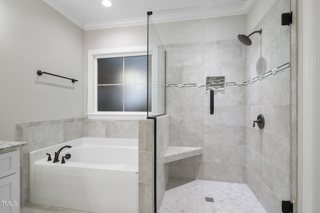 full bathroom featuring a stall shower, crown molding, a bath, and vanity