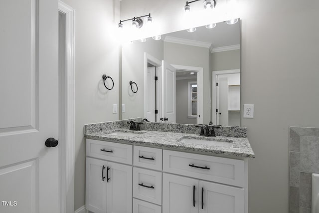 bathroom with double vanity, ornamental molding, and a sink