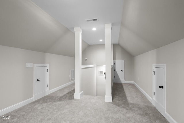 bonus room featuring vaulted ceiling, carpet floors, baseboards, and visible vents