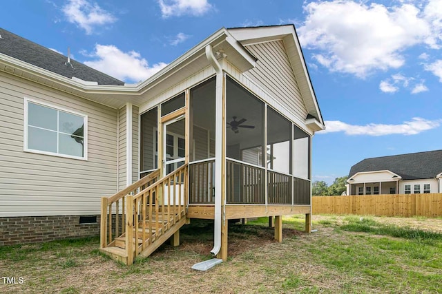 exterior space with ceiling fan