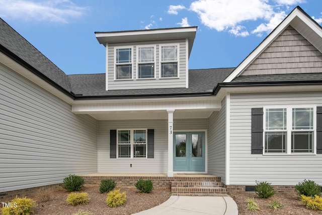 doorway to property featuring french doors and a porch