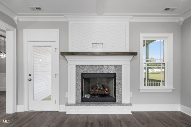 details featuring hardwood / wood-style flooring, ornamental molding, and a premium fireplace