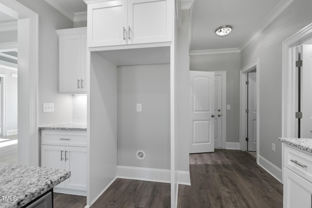 kitchen with white cabinets, light stone countertops, dark wood-type flooring, and ornamental molding