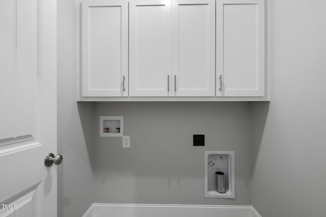 laundry room featuring washer hookup, electric dryer hookup, and cabinets