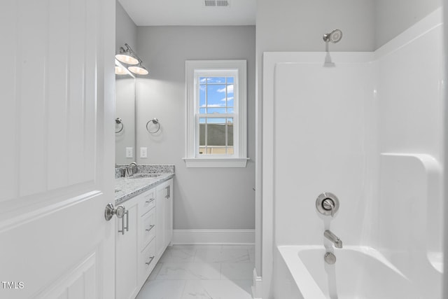 bathroom with shower / bath combination and vanity