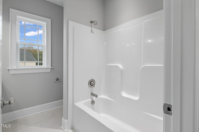 bathroom with bathing tub / shower combination