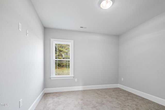 empty room with carpet flooring