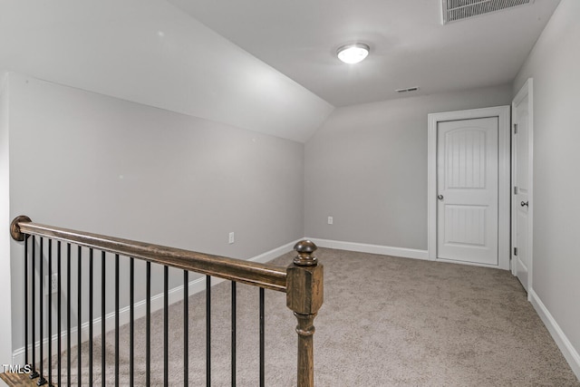 bonus room with carpet floors and lofted ceiling