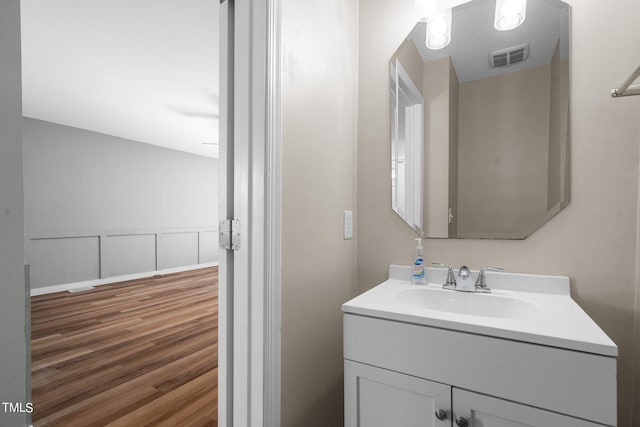 bathroom featuring vanity and wood-type flooring