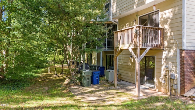 exterior space with central air condition unit and a balcony