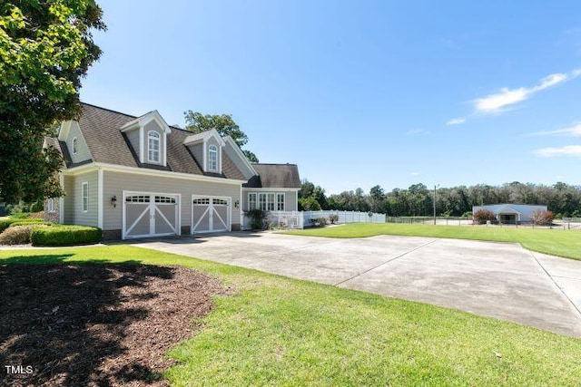 exterior space with a front yard and a garage