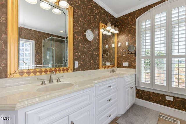 bathroom featuring vanity, tile patterned flooring, ornamental molding, and an enclosed shower