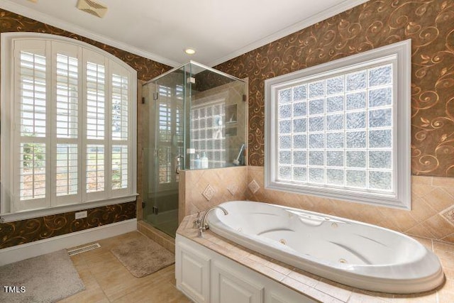 bathroom featuring tile patterned flooring, ornamental molding, and separate shower and tub