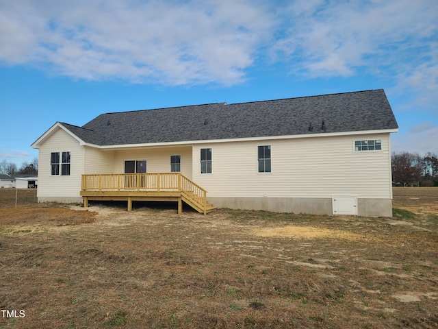 back of property featuring a deck